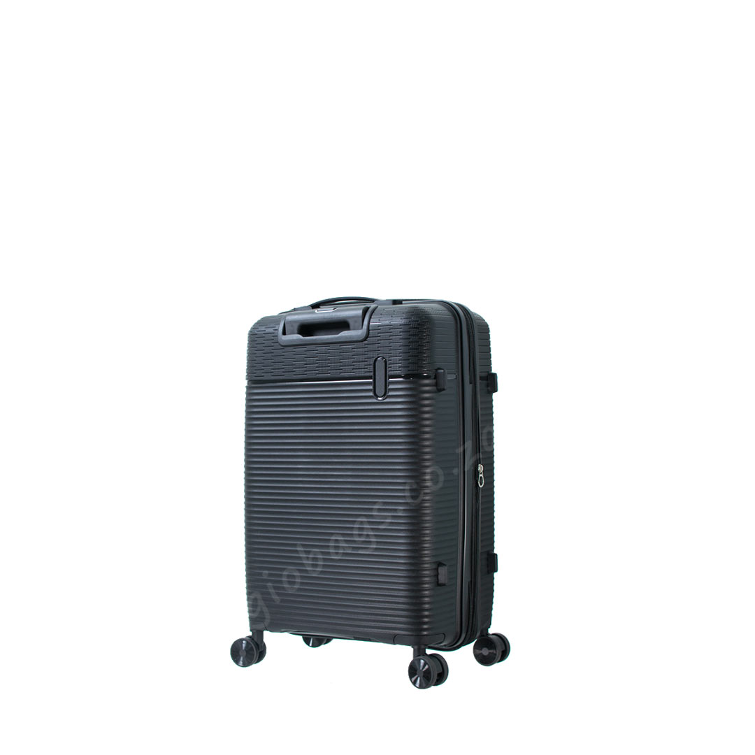 A sleek black hard shell suitcase with horizontal grooves and four wheels for easy mobility.