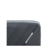 Close-up of a black hardshell suitcase with a textured surface and a logo labeled "travel mate."