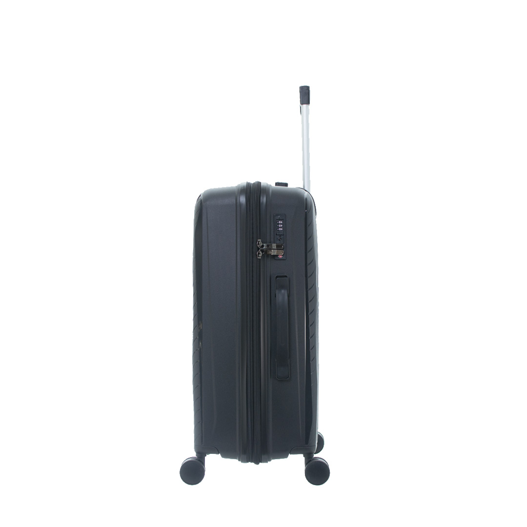 A side view of a sleek, TRAVELMATE black rolling suitcase with a retractable handle and wheels, featuring a combination lock and a textured surface.