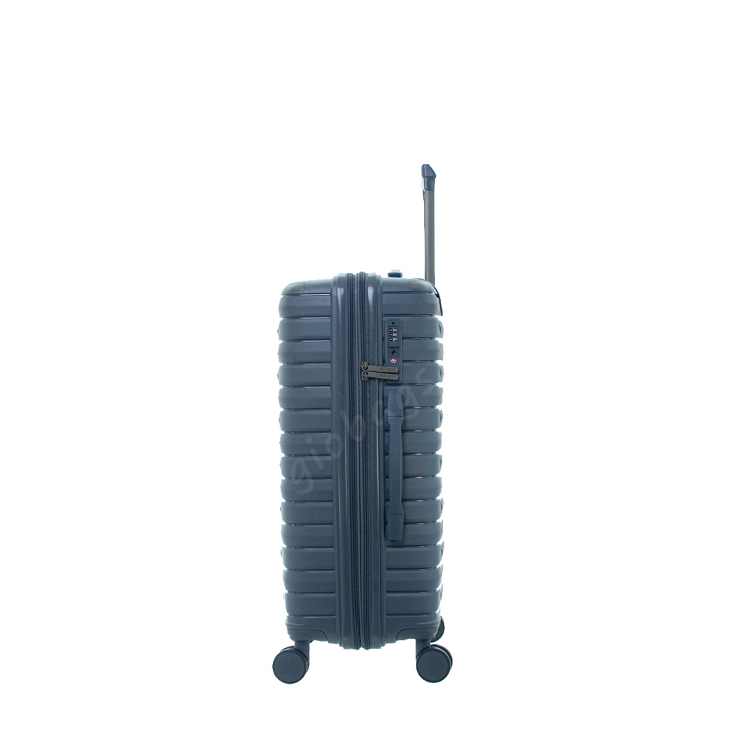 Side view of a sleek, dark gray hardshell carry-on suitcase with a retractable handle and wheels.