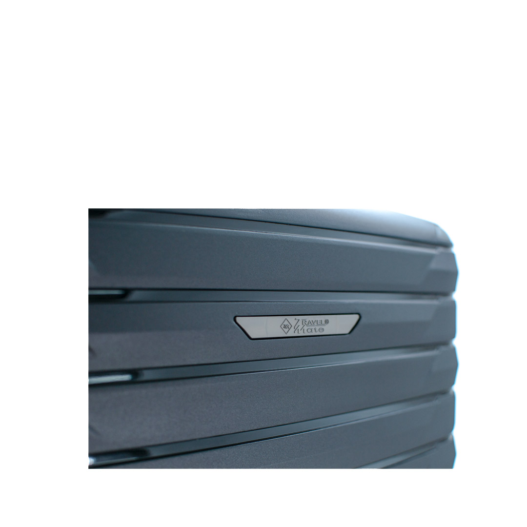 Close-up of a sleek dark suitcase showcasing its textured surface and brand emblem.