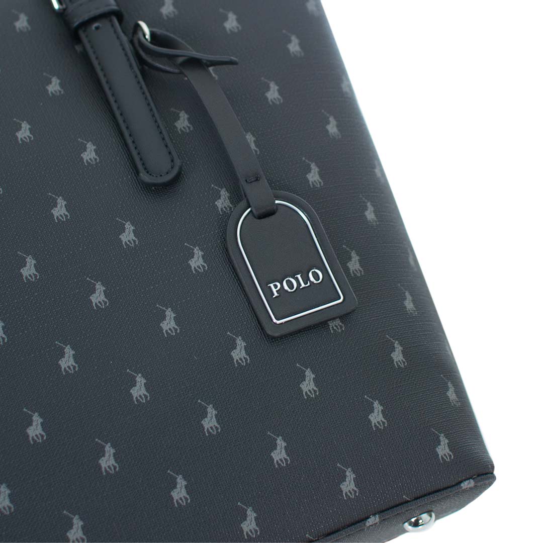 Close-up of the POLO luggage tag and signature Iconic monogram pattern on the POLO Medium Tote Bag.